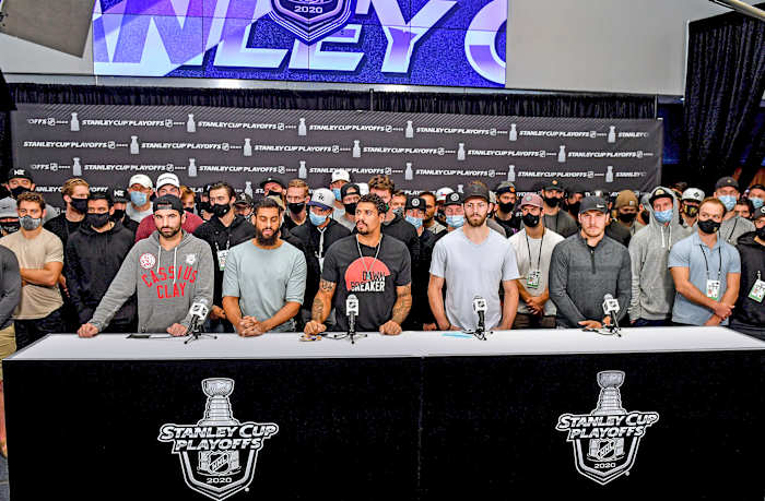 Nazem Kadri (left, in Cassius Clay sweatshirt) was the only HDA member left in the playoffs when the Jacob Blake shooting happened; he spoke alongside other players after play stopped following Blake’s shooting.